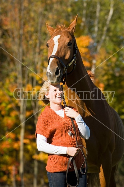 Young woman with her horse