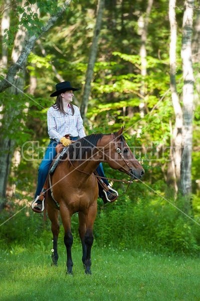 Young woman riding an American Quarter Horse gelding 