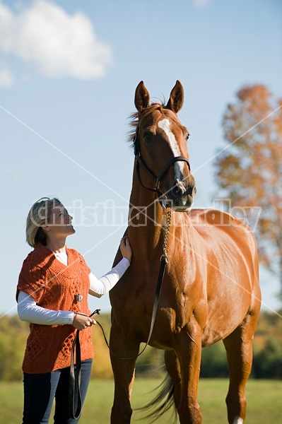 Young woman with her horse