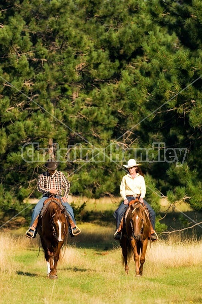 Husband and Wife Trail Riding Together