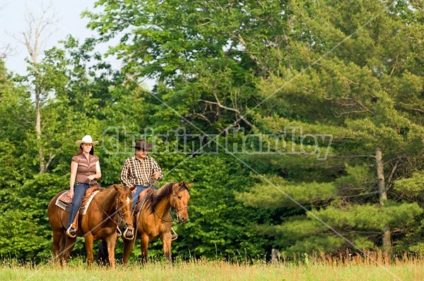 Young couple horseback riding