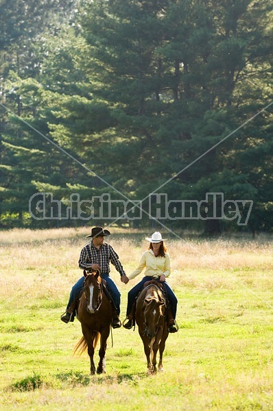 Husband and Wife Trail Riding Together