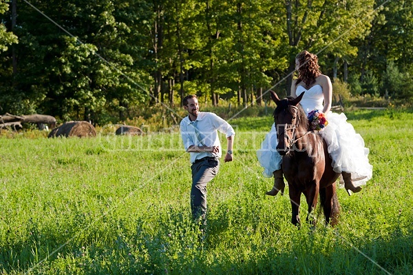 Bride and groom with horse