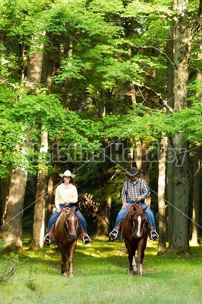 Husband and Wife Trail Riding Together