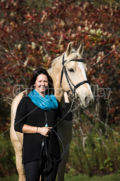 Woman with a palomino horse