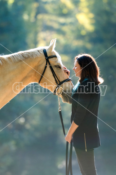 Woman with a palomino horse