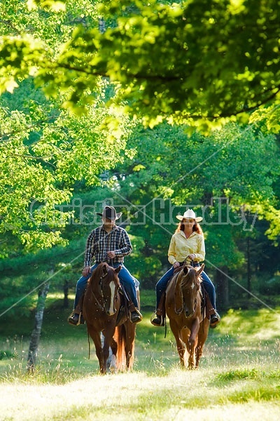 Husband and Wife Trail Riding Together