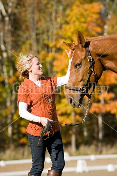 Young woman with her horse