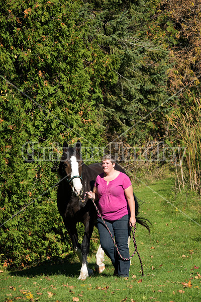 Portrait of a woman with her horse