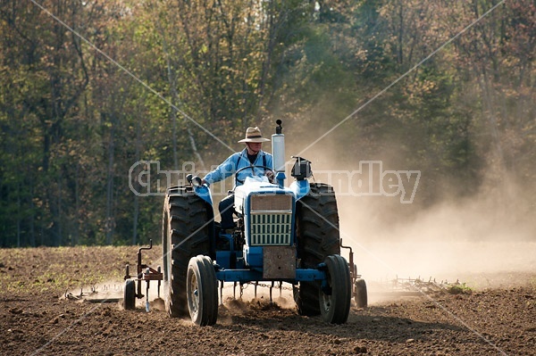 Farmer working up new field. 