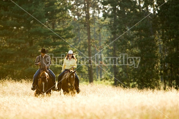 Husband and Wife Trail Riding Together