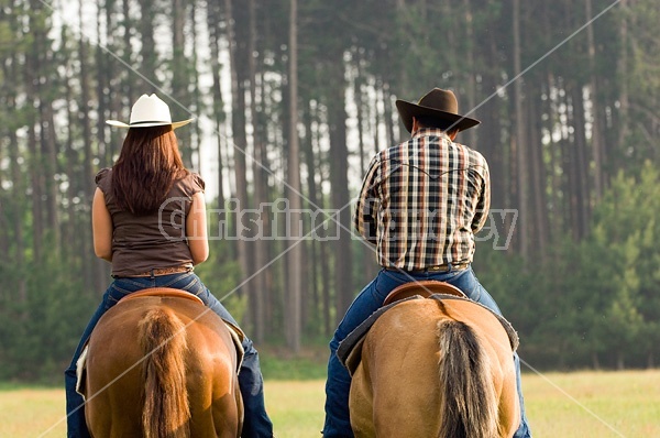 Young couple horseback riding