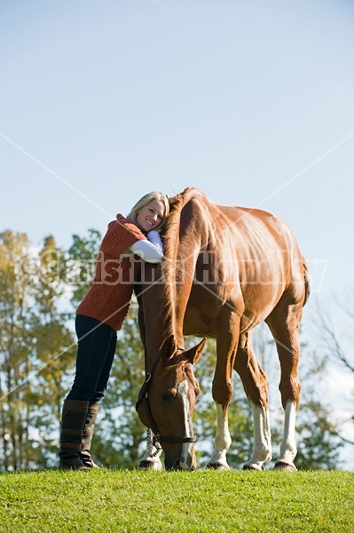 Young woman with her horse