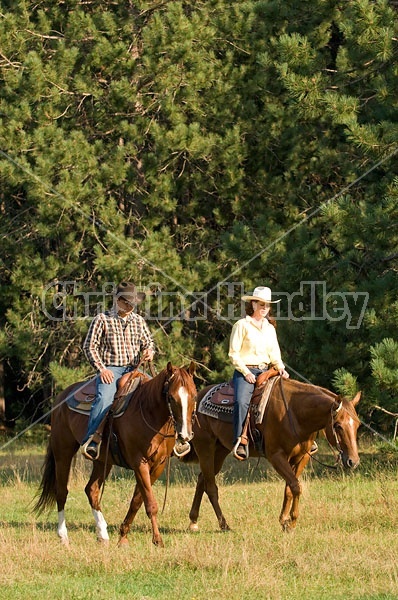 Husband and Wife Trail Riding Together