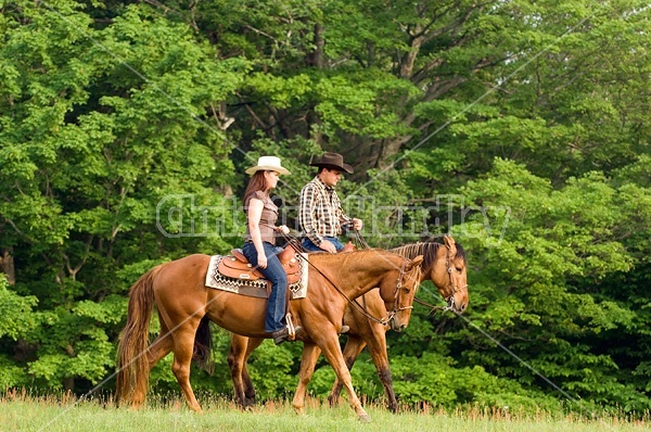 Young couple horseback riding