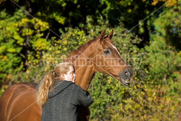 Woman with her Thoroughbred horse