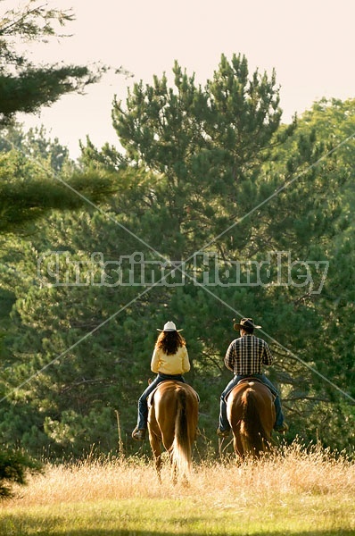 Husband and Wife Trail Riding Together