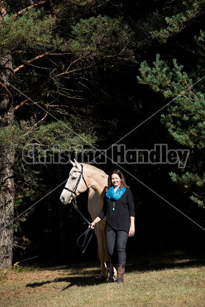 Woman with a palomino horse