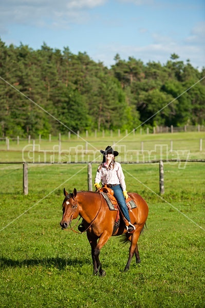 Young woman trail riding in Ontario Canada