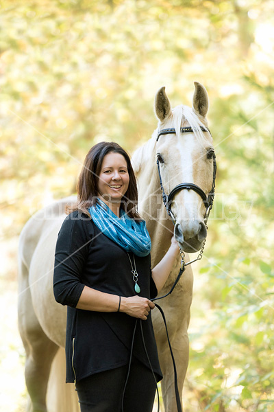 Woman with a palomino horse