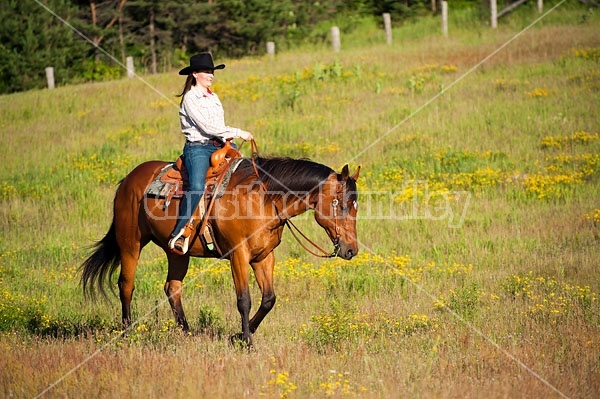 Young woman trail riding in Ontario Canada