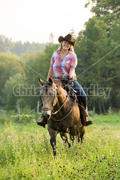 Young woman horseback riding western 