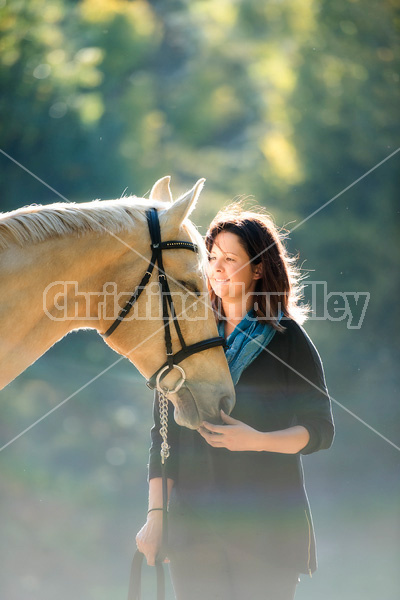 Woman with a palomino horse