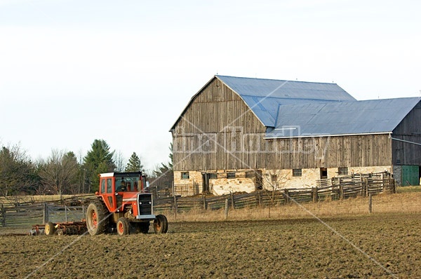 Farmer working a field in the springtime