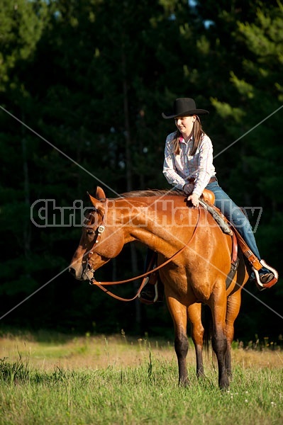 Young woman trail riding in Ontario Canada