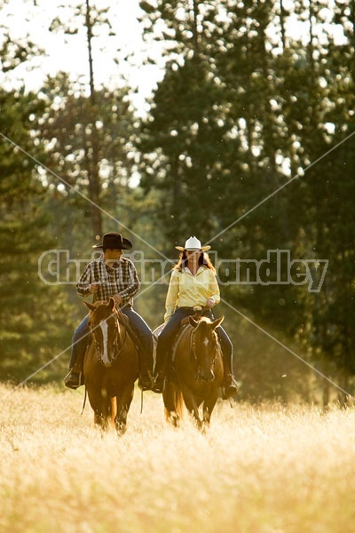 Husband and Wife Trail Riding Together