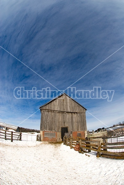 Barn and blue sky in the winter.