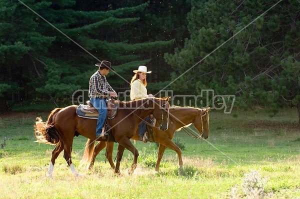 Husband and Wife Trail Riding Together