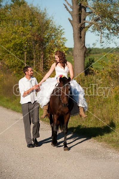 Bride and groom with horse