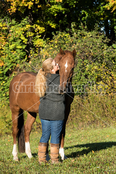 Woman with her Thoroughbred horse