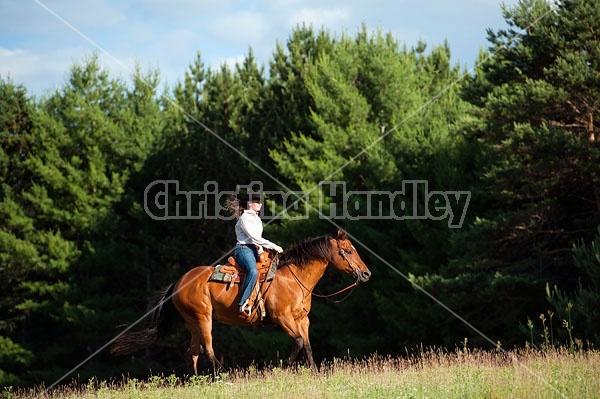 Young woman trail riding in Ontario Canada