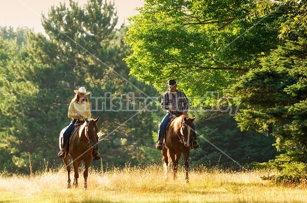 Husband and Wife Trail Riding Together