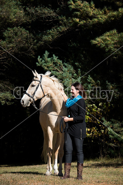 Woman with a palomino horse