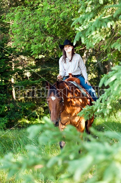 Young woman trail riding in Ontario Canada