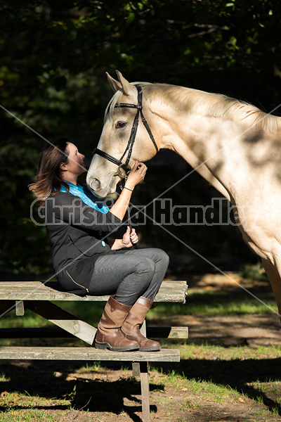 Woman with a palomino horse