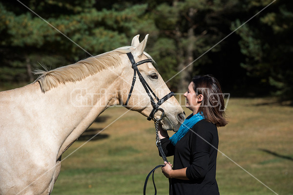 Woman with a palomino horse