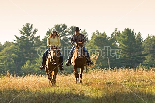 Husband and Wife Trail Riding Together