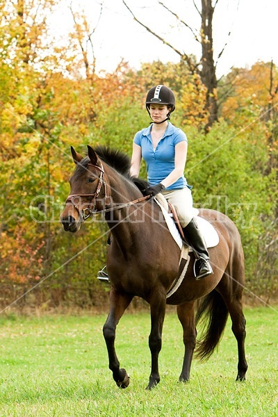 Young woman horseback riding