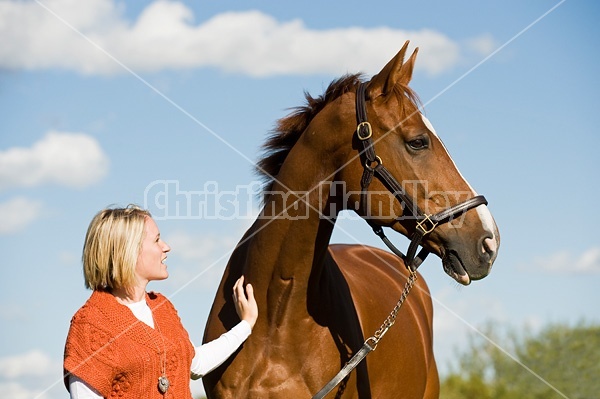 Young woman with her horse