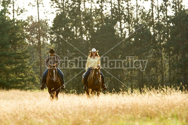 Husband and Wife Trail Riding Together