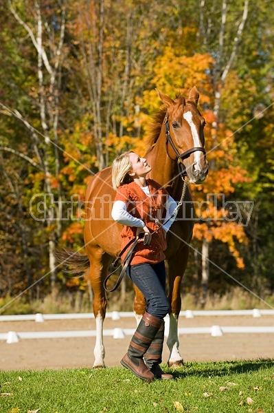 Young woman with her horse