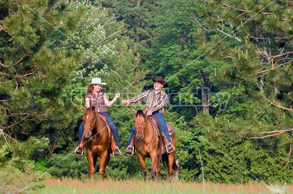 Young couple horseback riding