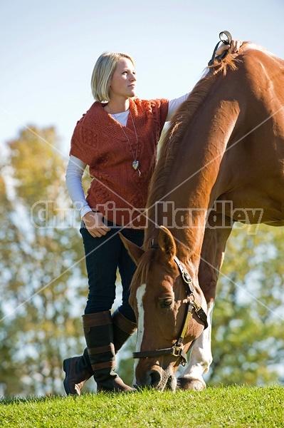 Young woman with her horse