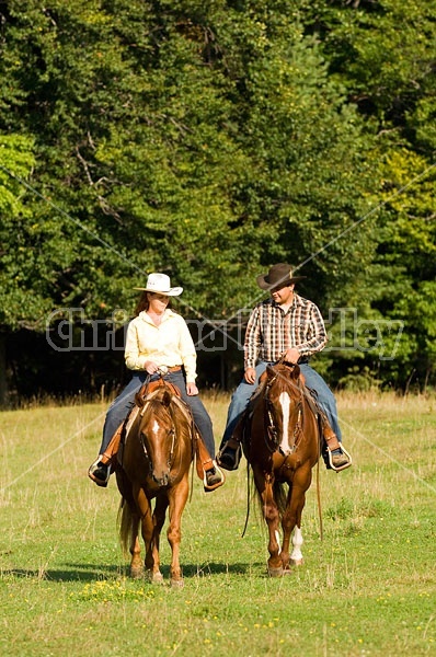 Husband and Wife Trail Riding Together