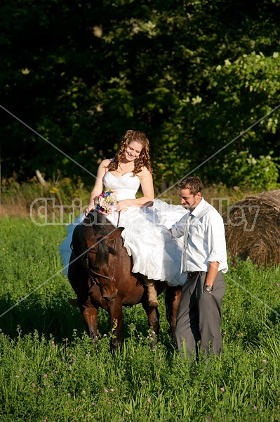 Bride and groom with horse