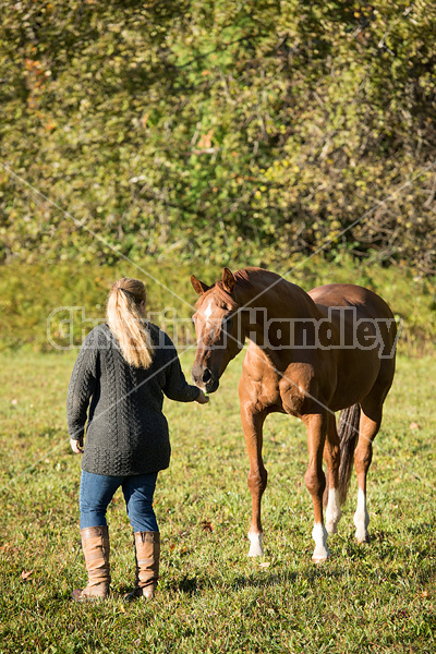 Woman with her Thoroughbred horse